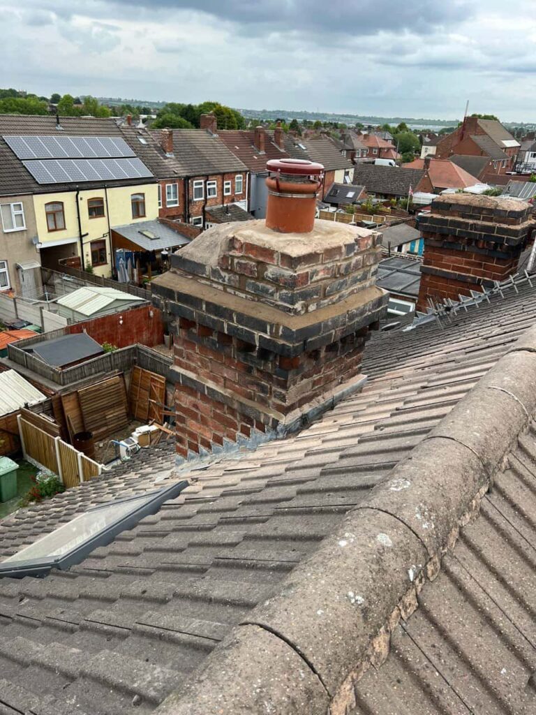 This is a photo taken from a roof which is being repaired by Bedworth Roofing Repairs, it shows a street of houses, and their roofs